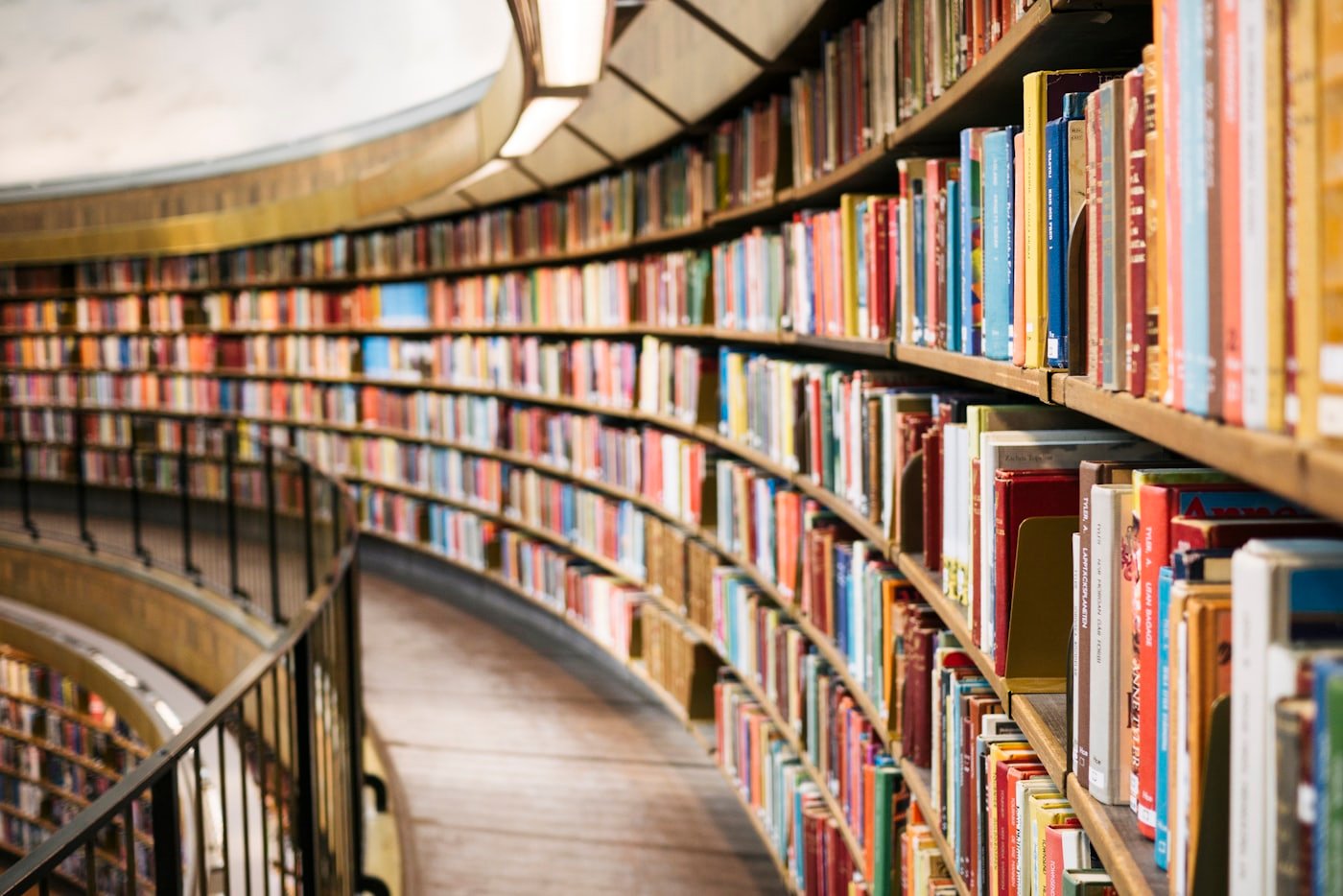 Curved shelving in an academic library reading room