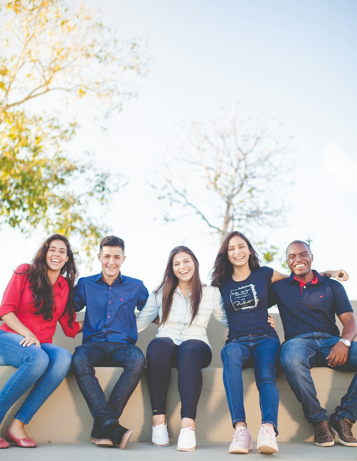 Researchers seated together outside a university building